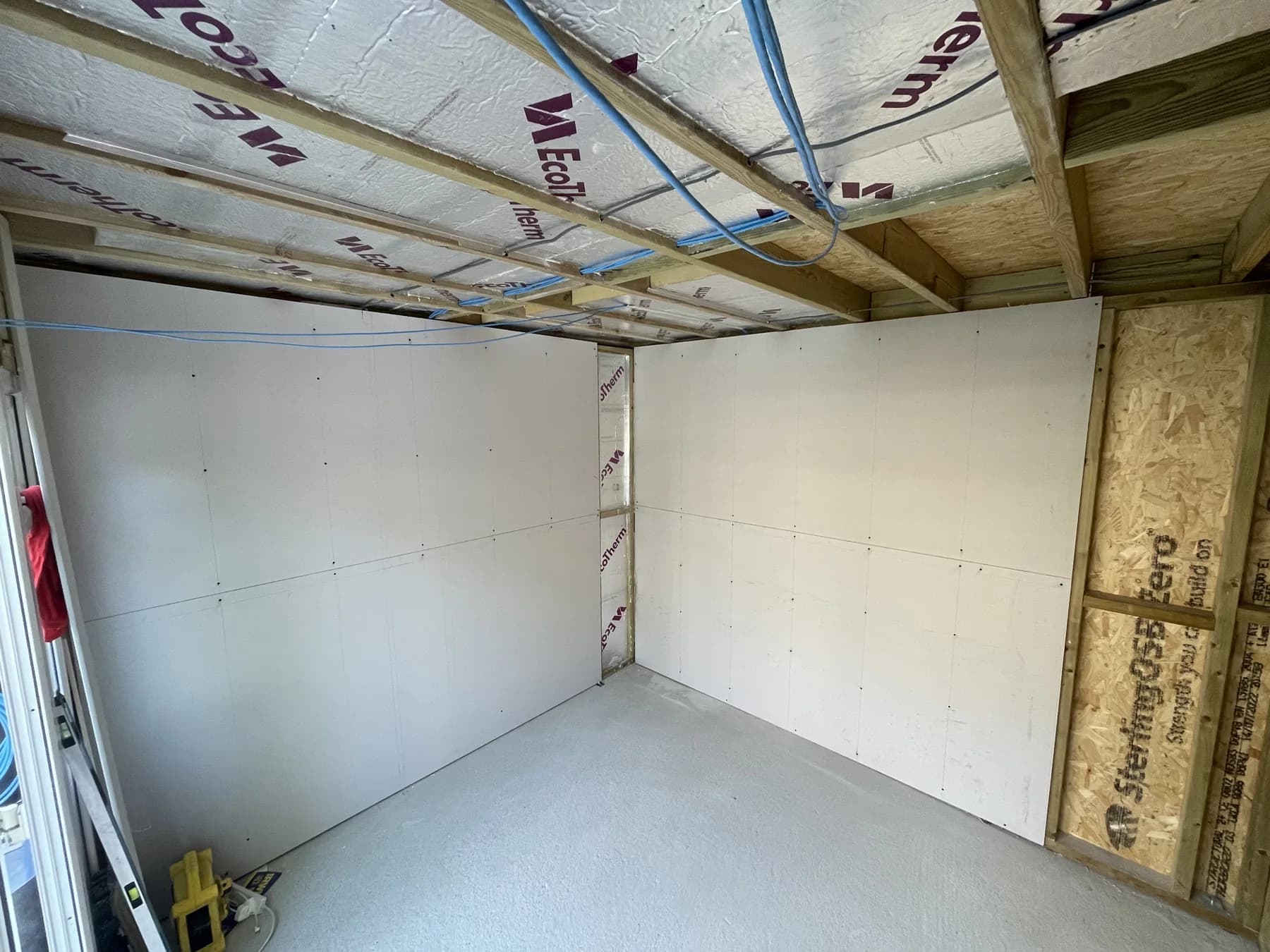 During construction — interior lining and ceiling insulation.