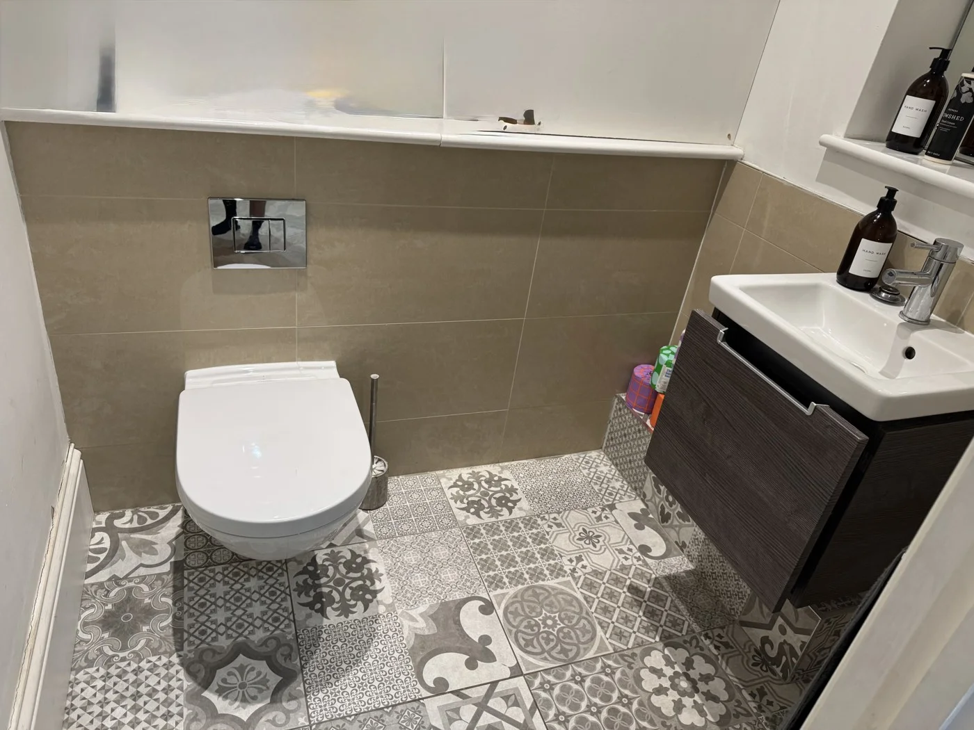 Before — the bathroom with its original wall tiles.