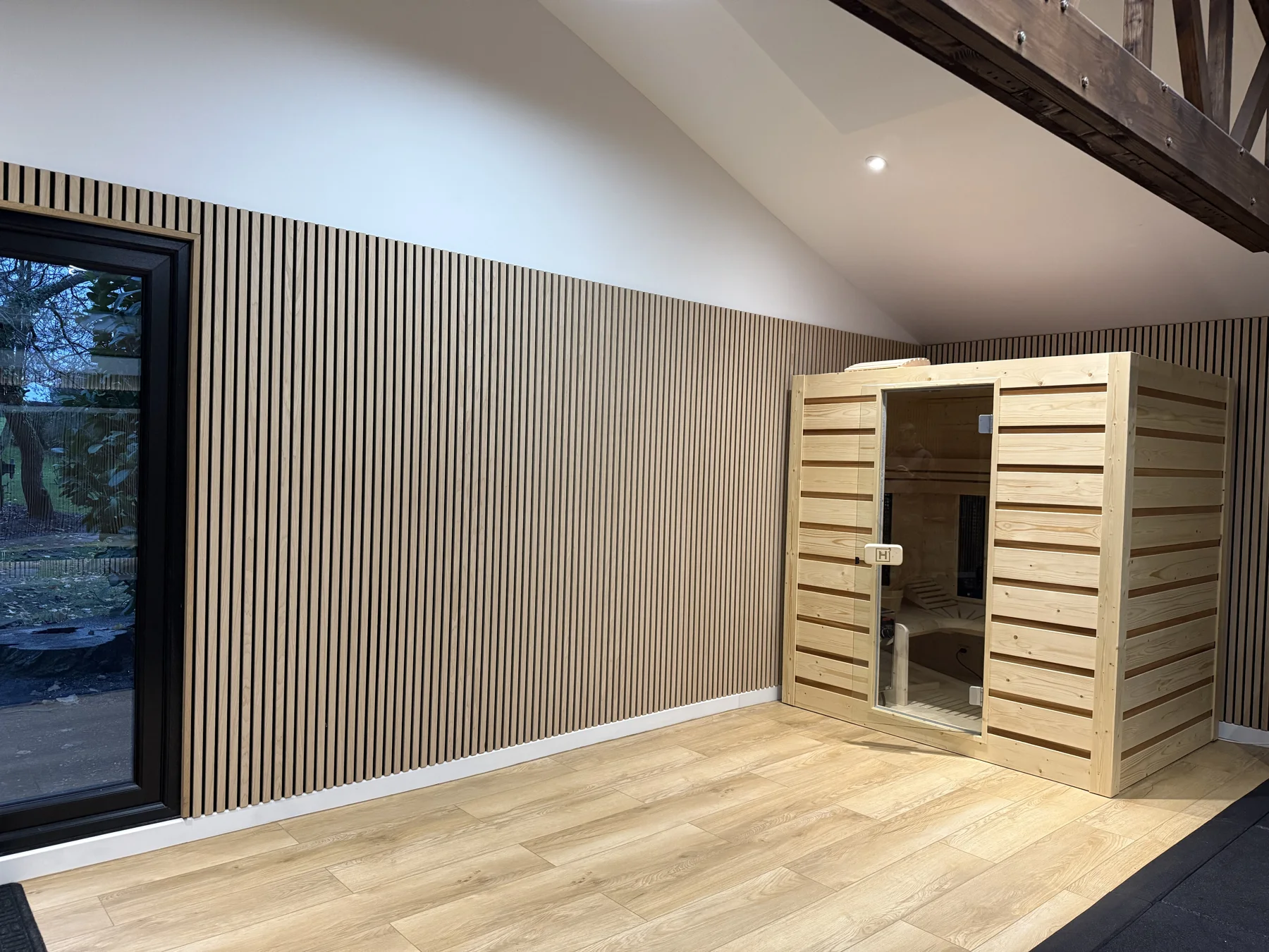 Finished gym — sauna and timber wall panelling.