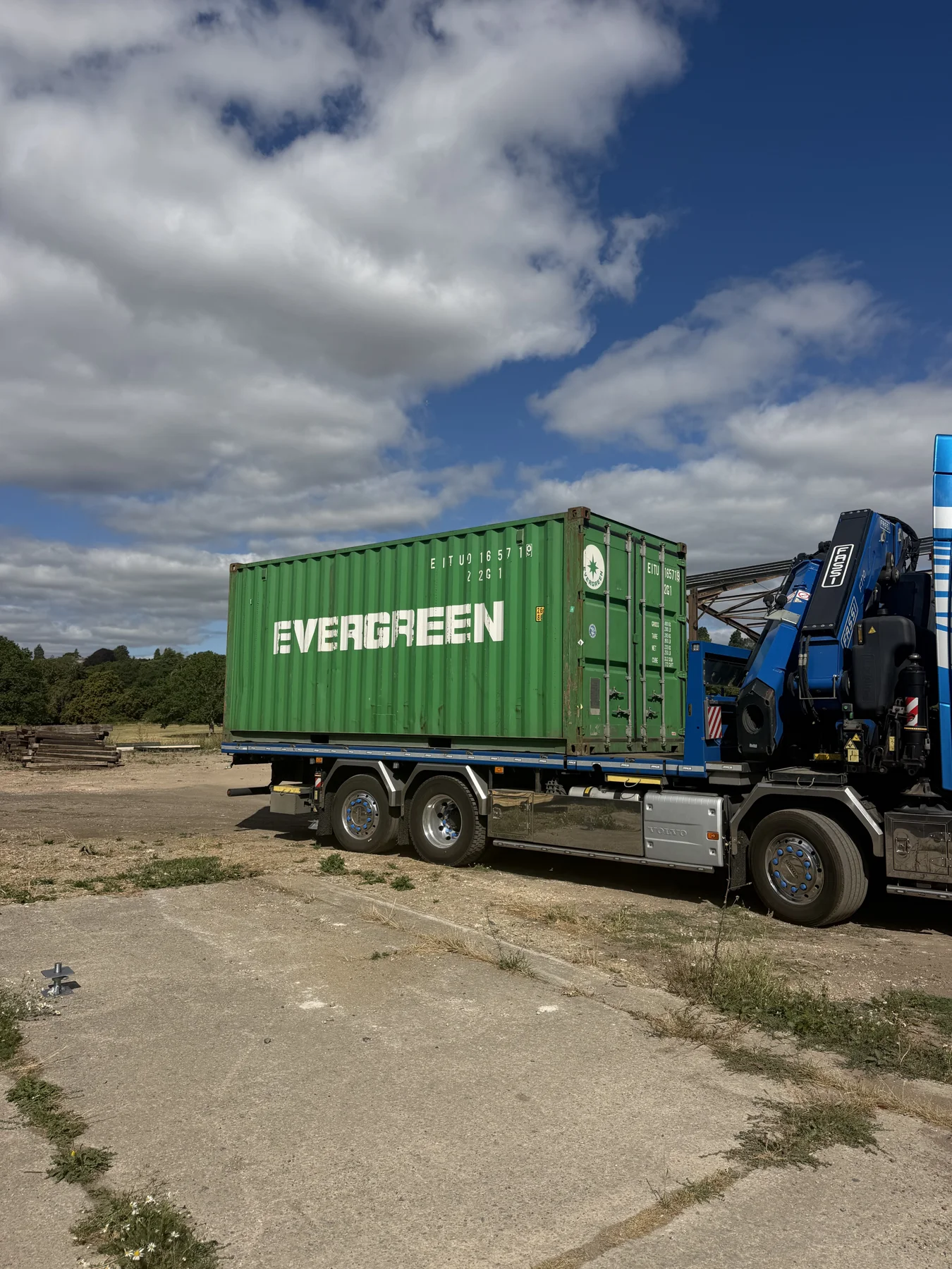 Before — the shipping container arriving on site.
