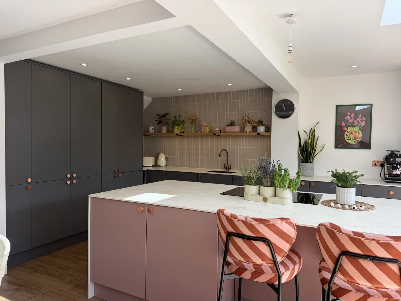 Phase two — the island, seating and kitchen shelving.