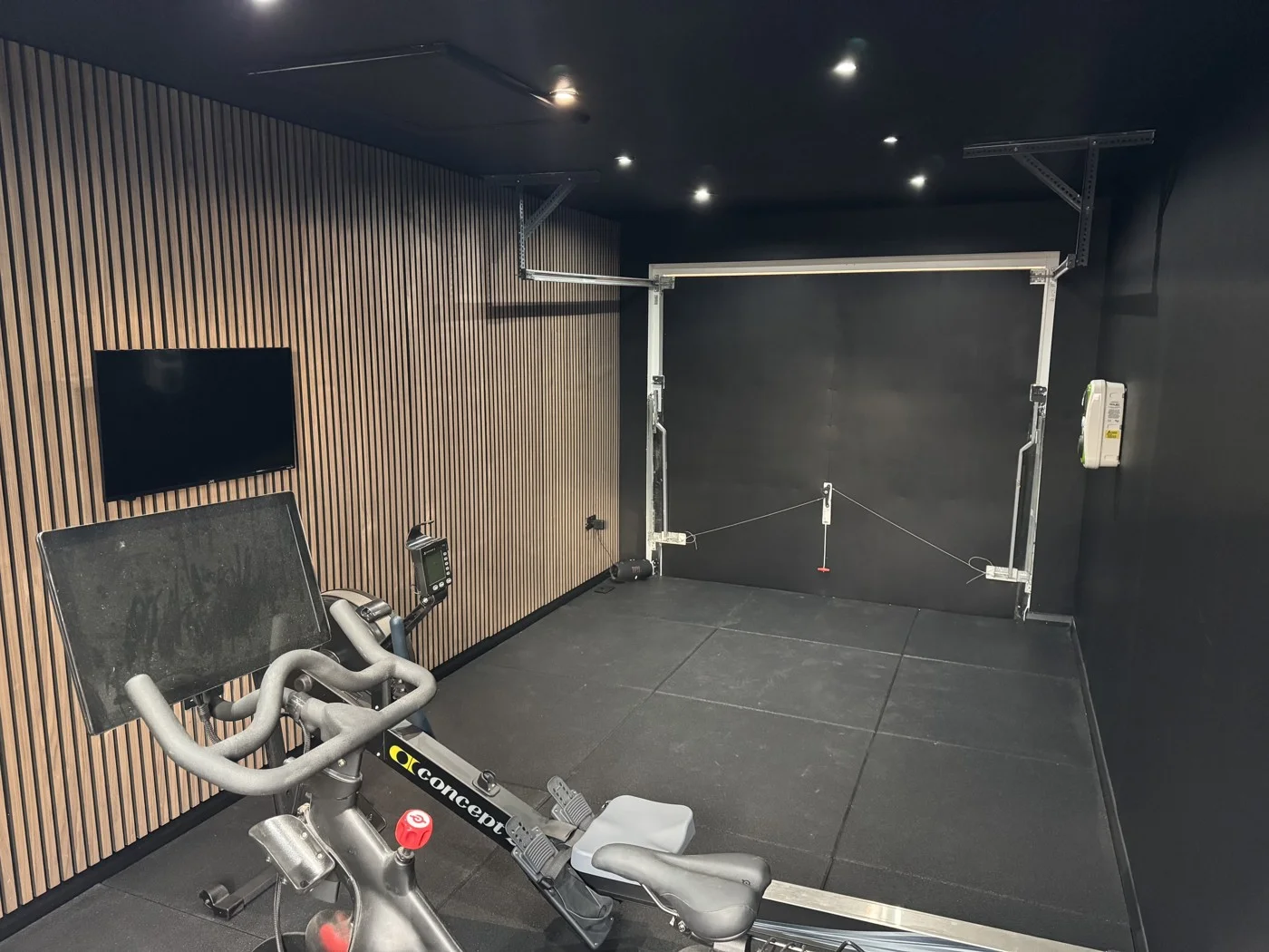 Garage gym looking toward the retained garage door.