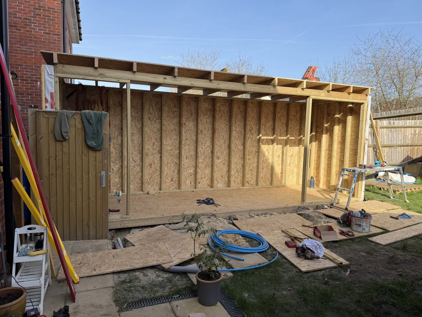 During construction — the timber frame takes shape.