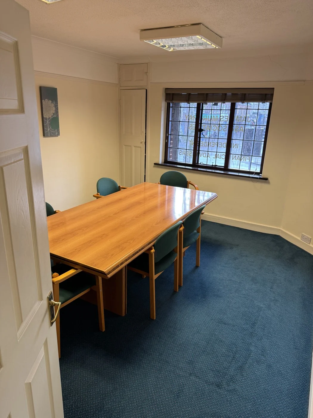 Before — the original meeting space and finishes.