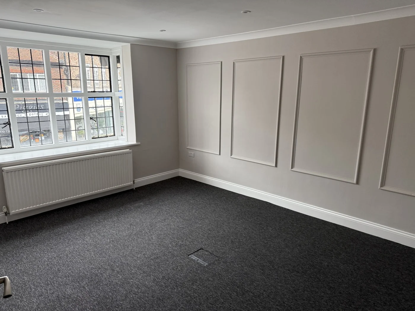Renovated Panda Projects office interior with decorative wall mouldings and new flooring