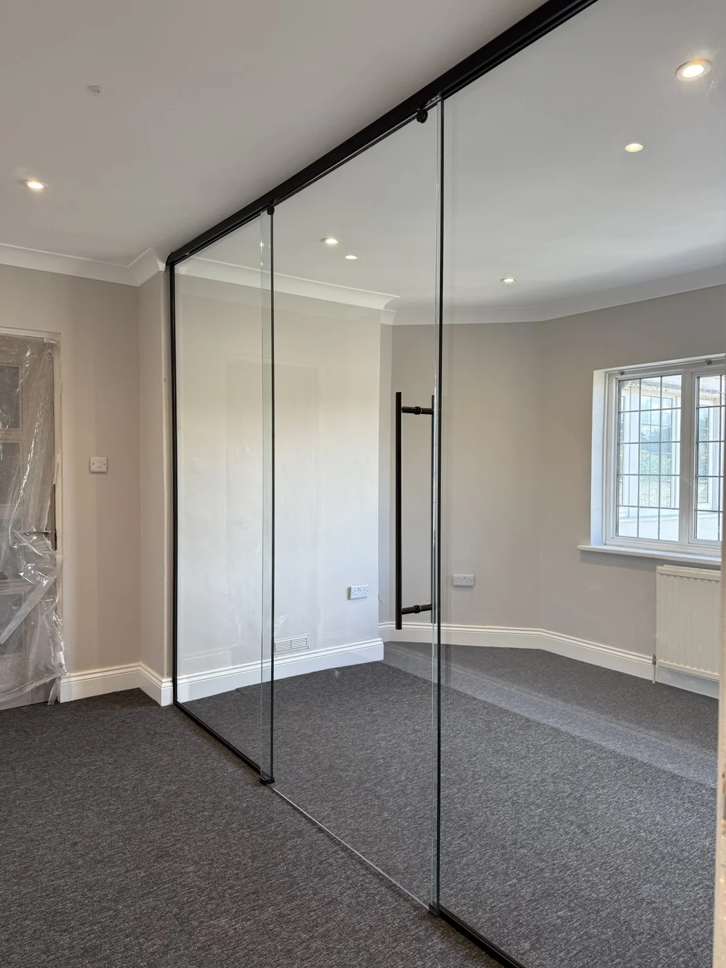 During the renovation — the new glazed meeting-room partition.
