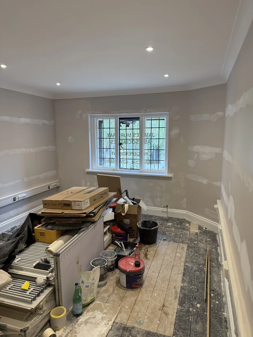 During the renovation — wall preparation and flooring work.