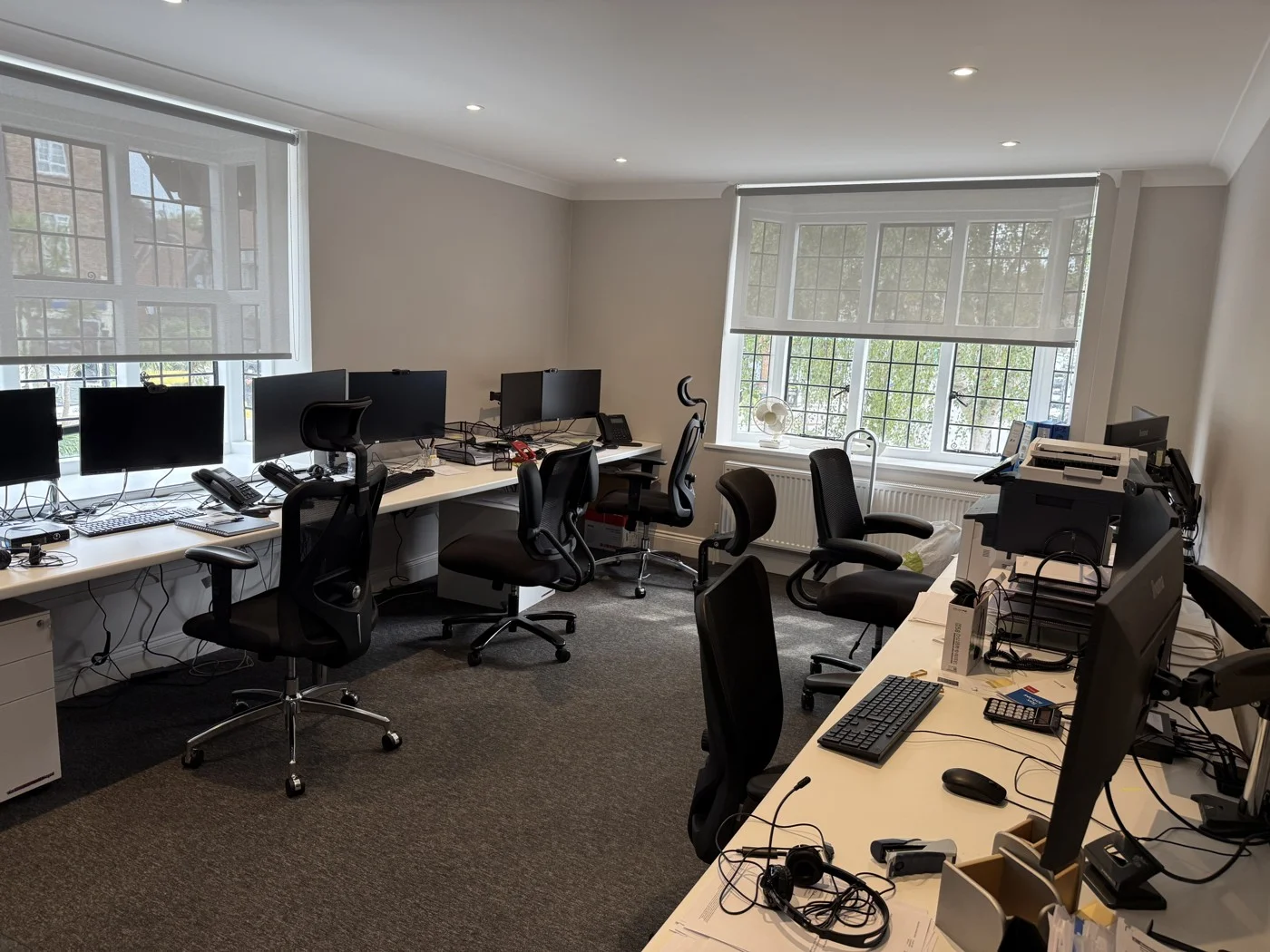 Refurbished office workspace with fresh decoration and new flooring.